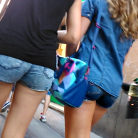 Two girls walking in shorts