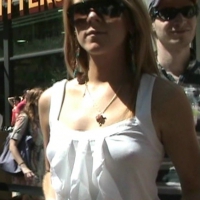 Braless redhead in white top