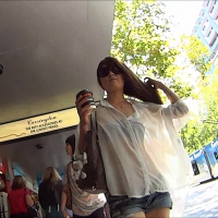 Asian girl in shorts and see thru shirt