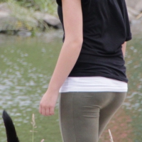 Blonde out dog walking in green leggings Blonde in green leggings