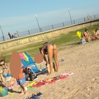 Blonde sexy babe in thong bikini on the beach with friends Blonde ass in thong