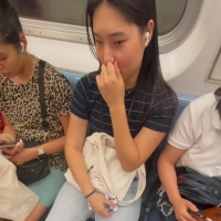 Candid Asian train girl trying not to laugh while noticing the shooters bulge 1_4947350885274485528.MOV-2025-06-08-12h53m30s644.jpg