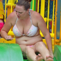 Thick lady with big boobs in a bikini at the pool Thick lady at the pool