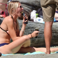 Blondes on the beach in bikinis eating ice cream Blondes eating ice cream