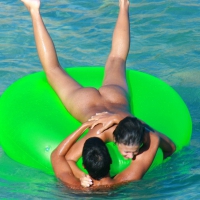 FKK Nudists playing in the water with floater Uka FKK water floater fun