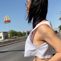 Asian girl showing her bra