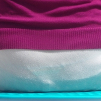 Lady sitting in semi see through white skirt revealing her thong Lady sitting in semi see through skirt