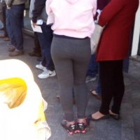 Black girl standing around in grey leggings Black girl in grey leggings