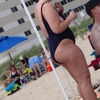 Thick blonde in blue swimsuit at the beach Thick blonde in swimsuit