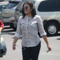 Lady on the phone in tight pants