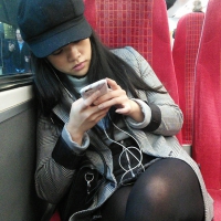 Asian in skirt and stockings