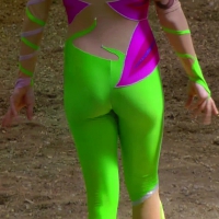 Equestrian performer in green spandex
