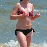 Cute beach girl in the water