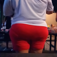 Old thick lady in tight red shorts with a big ass and vpl Old fat lady in red shorts