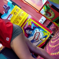 Arcade teen in shorts