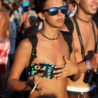 Boobs out in public in either bikini tops or bras Boobs in bikini tops and bras