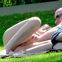 Girl laying out in a bikini wit...