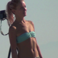 Skinny blonde beach babe with small tits