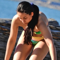 Hot brunette beach girl in a colorful bikini Brunette in colorful bikini