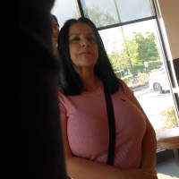 Brunette milf in line getting food with big tits Brunette milf with big tits