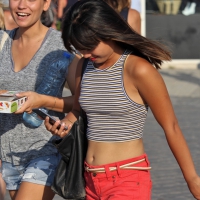 Cute Asian in little pink shorts walking with a friend Cute Asian in little shorts