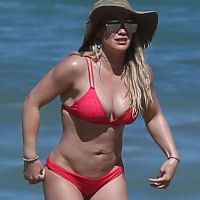 Hilary Duff looking sexy in a red bikini on a beach in Mexico Hilary Duff in red bikini in Mexico
