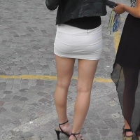 Sexy skinny blonde in tight mini skirt
