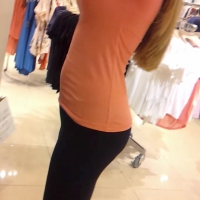 Teen in orange top and spandex