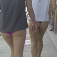 Black thong teen and friend in purple bikini