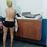 A couple of sexy girls in bikinis and lingerie in changing area Girls in bikinis and lingerie in changing area