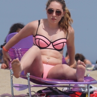 Cute babe in pink and black bikini with a bit of camel toe Cute babe in pink bikini
