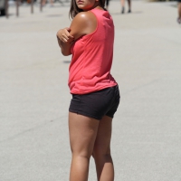 Thick girl in pink top and black shorts with vpl Thick girl in black shorts