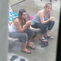 Two milfs at the pool in tight leggings Two milfs in leggings