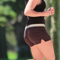 Cute girl running in short shorts Cute girl running