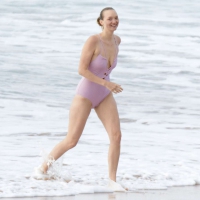 Gemma Ward in pink swimsuit and leggings on Palm Beach Gemma Ward in swimsuit and leggings