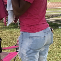 Older ebony lady in shorts at the ballpark Ebony lady at the ballpark