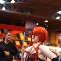 Cosplay babe in shiny shorts