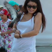 Hot brunette playing with birds