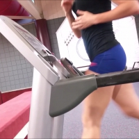 Sexy girl working out in blue spandex shorts