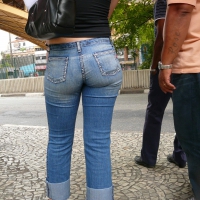 Red haired lady with a nice ass in tight jeans waiting for the bus Red haired lady in tight jeans