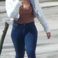 Black babe walking in jeans and showing some cleavage Black babe in jeans