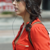 Babe in pink shorts walking showing a bit of cleavage and almost a nip slip Babe walking showing cleavage