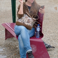Various candid beautiful women in different outfits in public 98482383@N03_49907764641_Smoker on a Bench 1.jpg