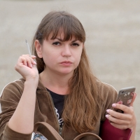 Various candid beautiful women in different outfits in public 98482383@N03_49907764496_Smoker on a Bench 2.jpg