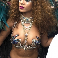 Rihanna looking sexy and showing skin in a sexy costume Rihanna in sexy costume