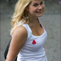 Blonde girl showing her cleavage laughs as she realizes shes getting pictures of her tits taken Blonde laughing while busted
