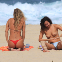 Sexy girls topless on a nude beach showing their nice tits Sexy topless beach girls