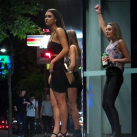 3 sexy club girls drinking in public