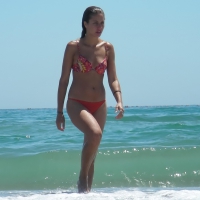 Sexy beach babe in thong