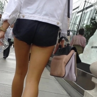 Cheeky girl in black shorts